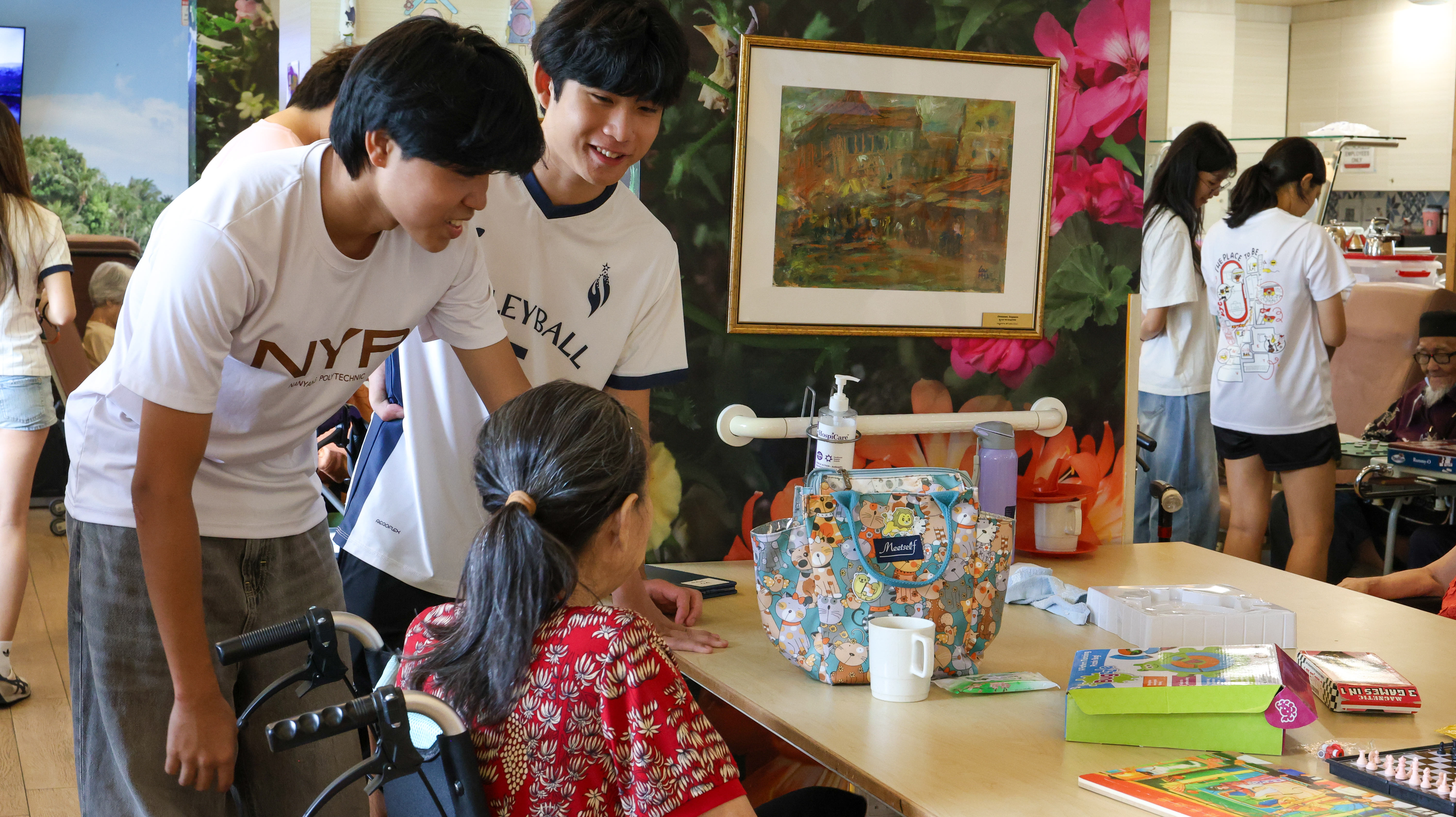 Nanyang Poly and Yishun Innova Students chatting with a senior